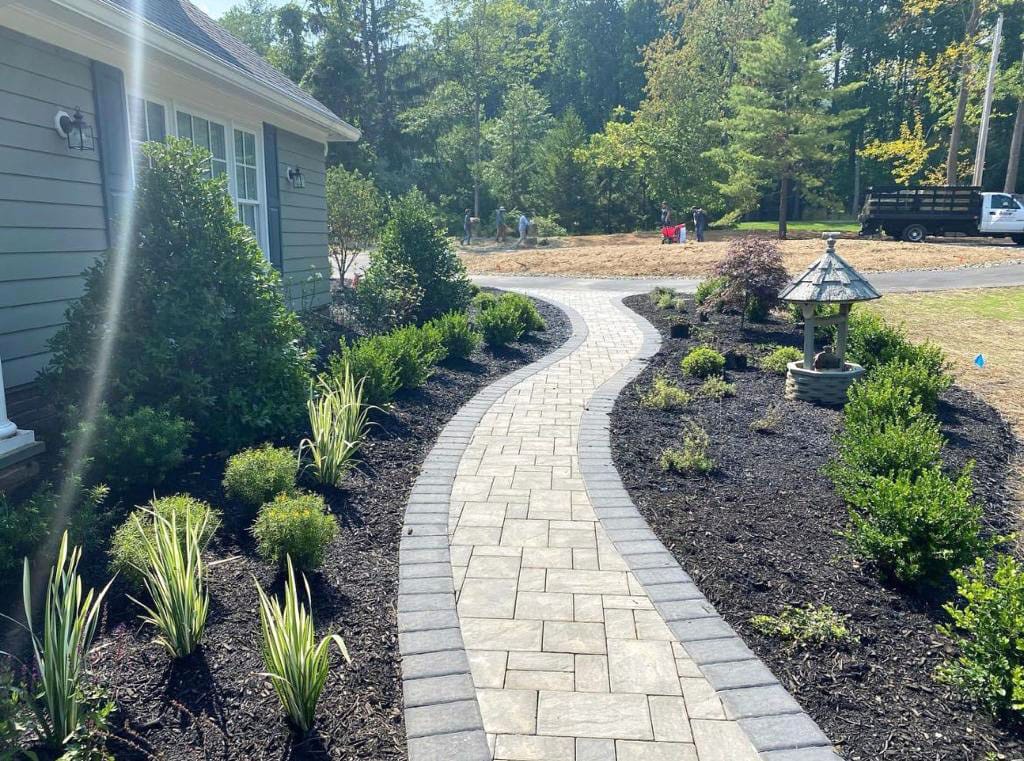 Bluestone and paver walkway winding through the yard